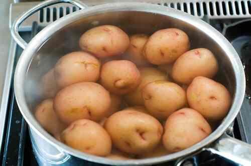 Boiling fresh harvest potatoes