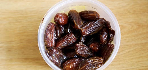 A plastic container of sweetened dates