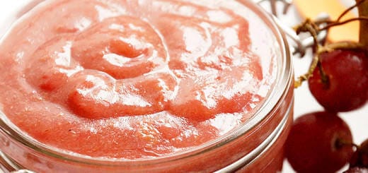 A jar of homemade red grape sauce.